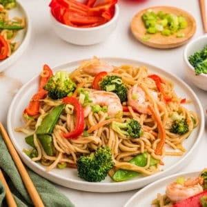 Shrimp stir fry recipe with lo mein noodles on a plate.