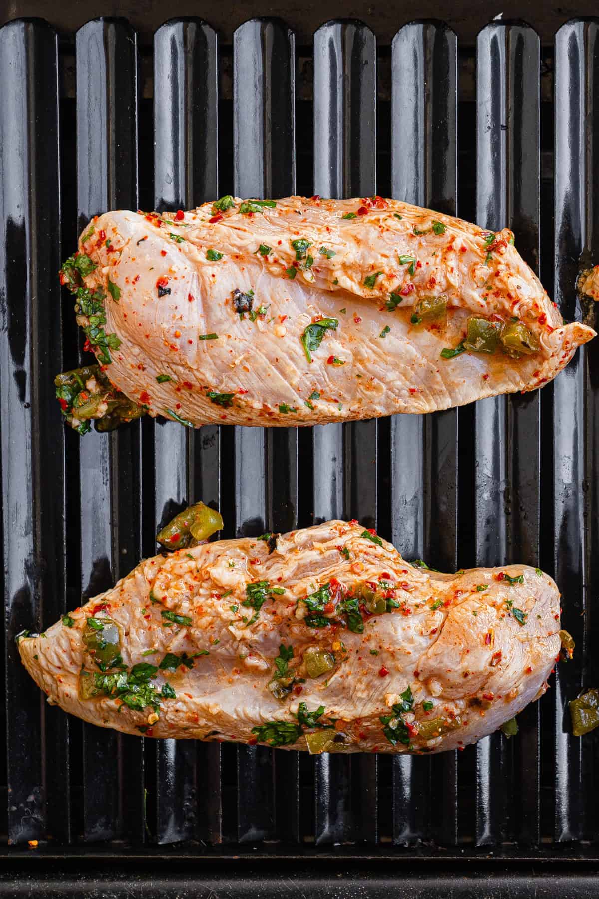 The chicken on a grill.