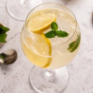 A classic gin and elderflower liquor drink also know as a Hugo Spritz.