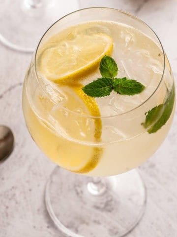 A classic gin and elderflower liquor drink also know as a Hugo Spritz.