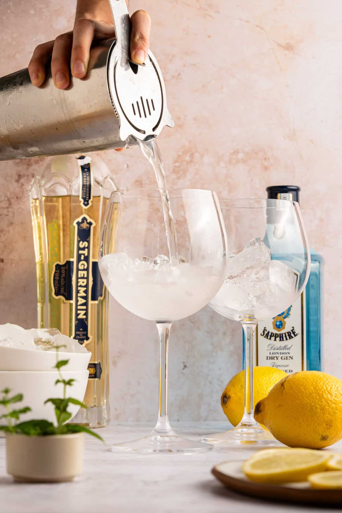 Pouring ingredients into glasses.